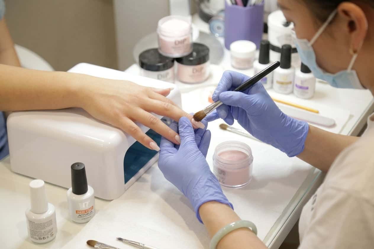 A professional dip powder application ensures both beauty and safety